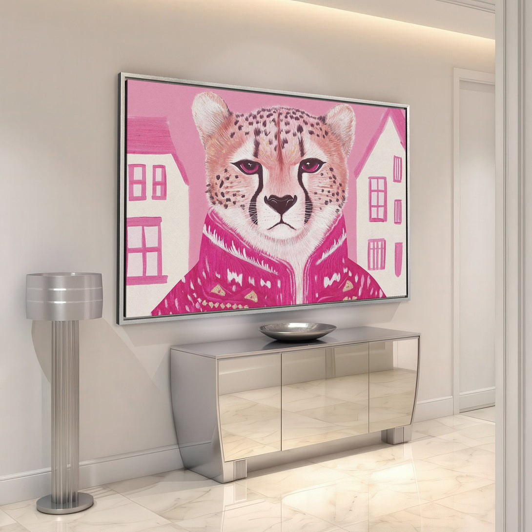 Framed Wall Art featuring a stylish cheetah portrait in pink hues. Modern canvas print with a playful, artistic design, perfect for adding a pop of color to any room.