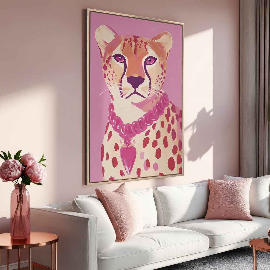 Framed Wall Art featuring a stylish cheetah portrait in a pink and peach color palette. Perfect for adding a touch of modern art to your home decor.