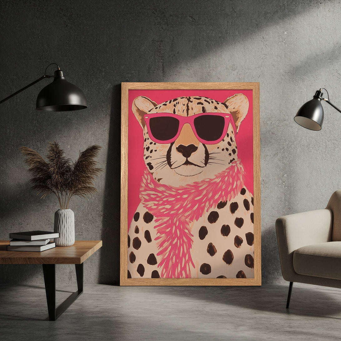 Framed Poster featuring a stylish cheetah in pink sunglasses and scarf. Pop art style with a pink, brown, and neutral color palette. Add a touch of fun to your space!