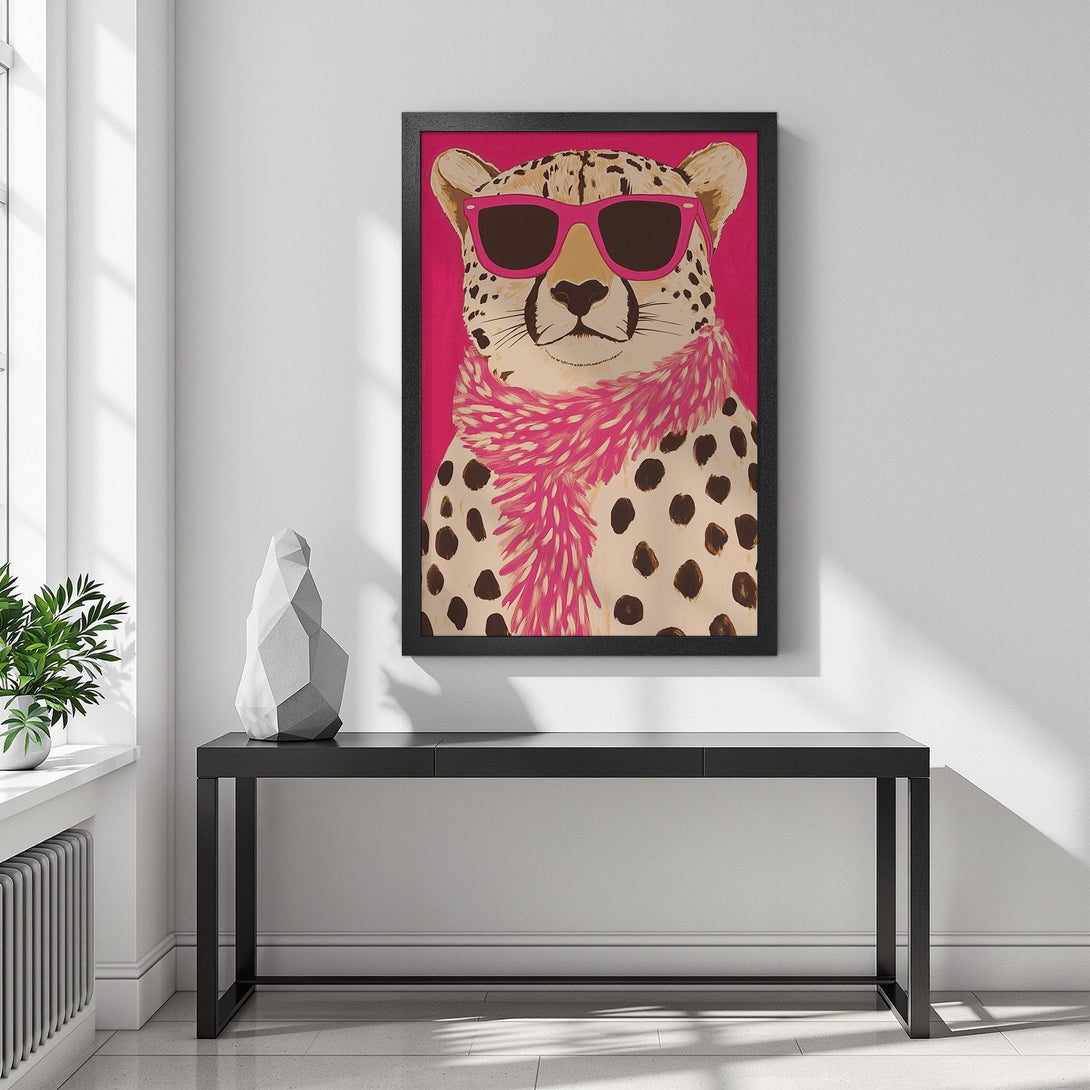 Framed Poster featuring a stylish cheetah wearing sunglasses and a pink scarf. Fun, modern art with a pink, brown, and white color palette. Perfect wall decor!