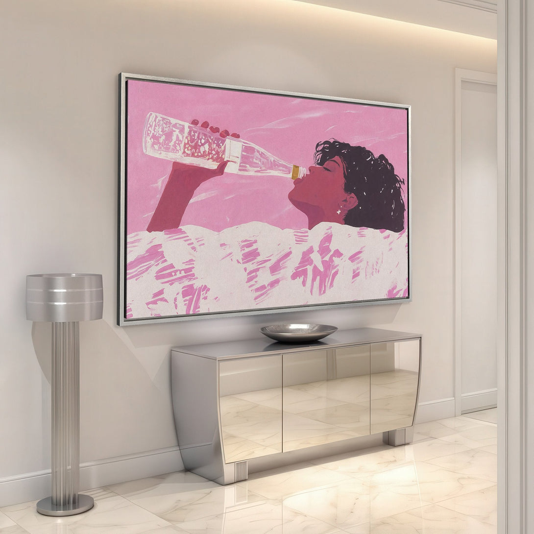 Framed Wall Art: Woman drinking from a bottle in a pink and white abstract style. Perfect for adding a pop of color to your space!