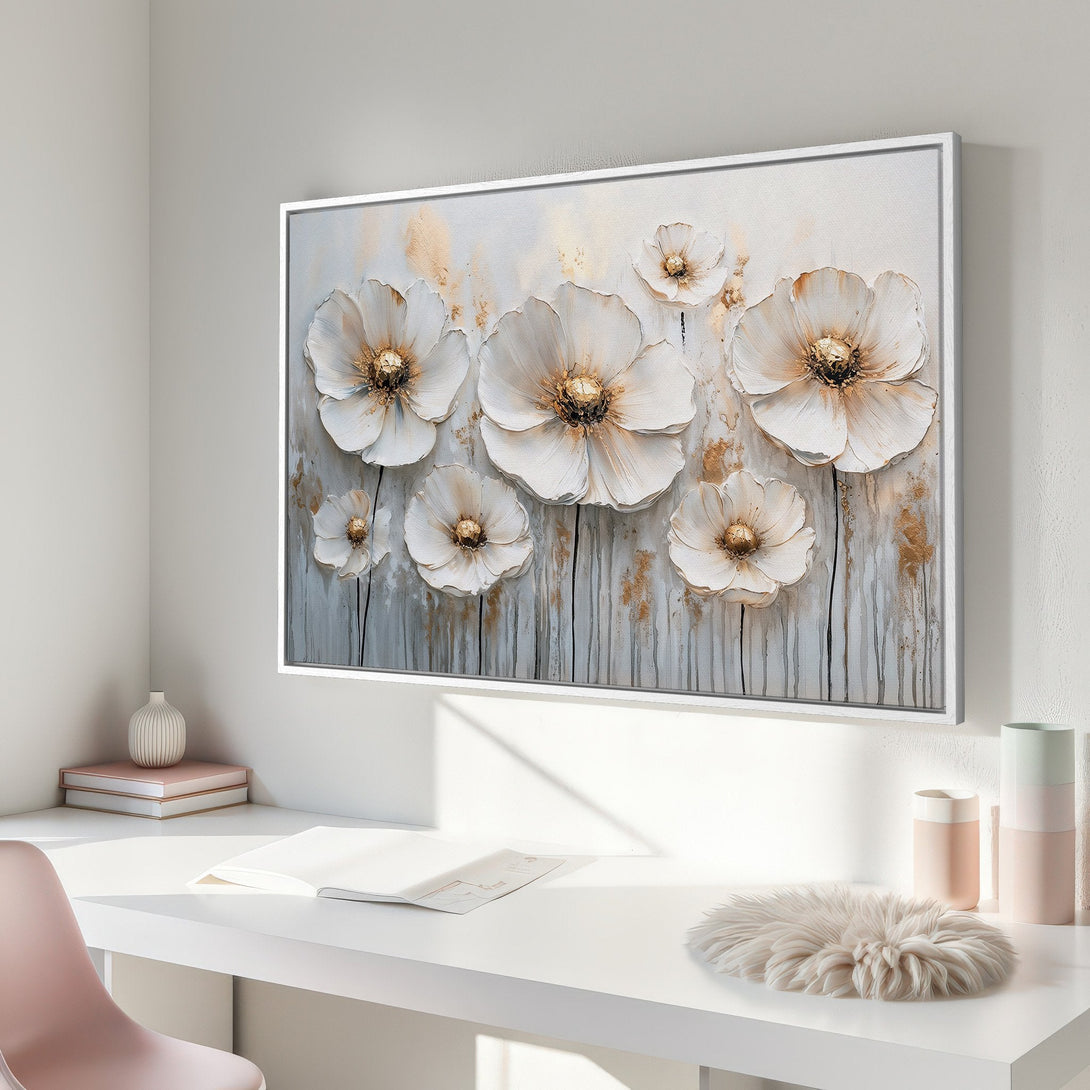 Framed Wall Art: Elegant white flower canvas print with gold accents, displayed in a modern interior. Soft, neutral color palette for a serene home.