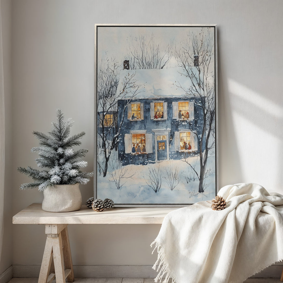 Framed Wall Art of a cozy winter home scene in a watercolor style. Features a blue and white color palette, perfect for holiday decor.