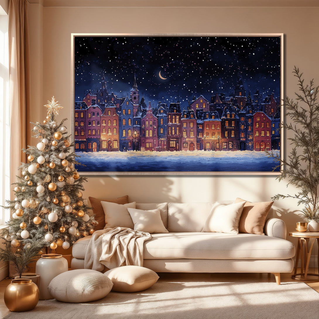Framed Wall Art: Winter cityscape Canvas Print in blue, pink, and gold tones. Cozy interior decor with Christmas tree. Perfect for holiday home styling.