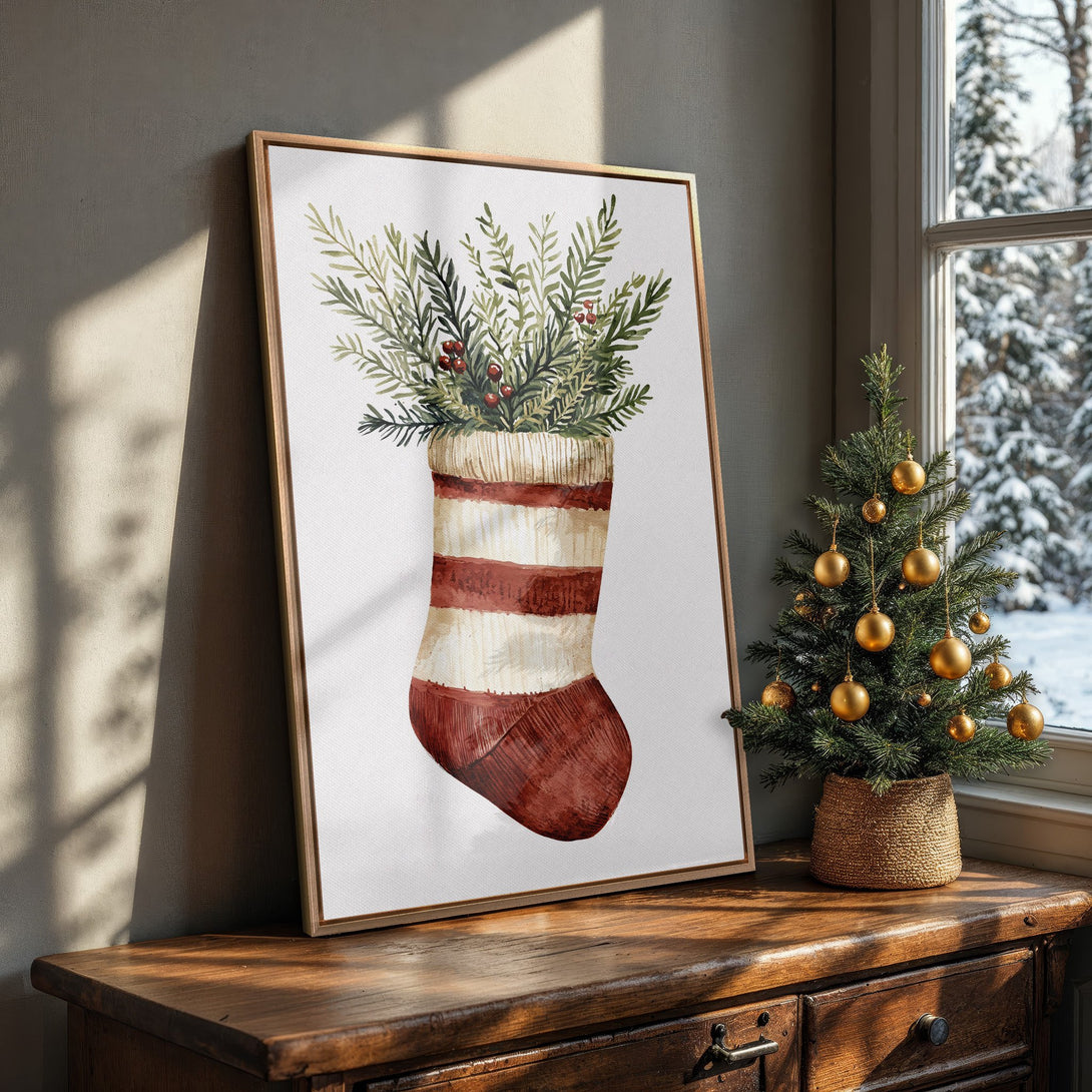 Framed Wall Art featuring a watercolor Christmas stocking with greenery, in a warm, inviting interior. Festive holiday decor with a cozy, natural color palette.