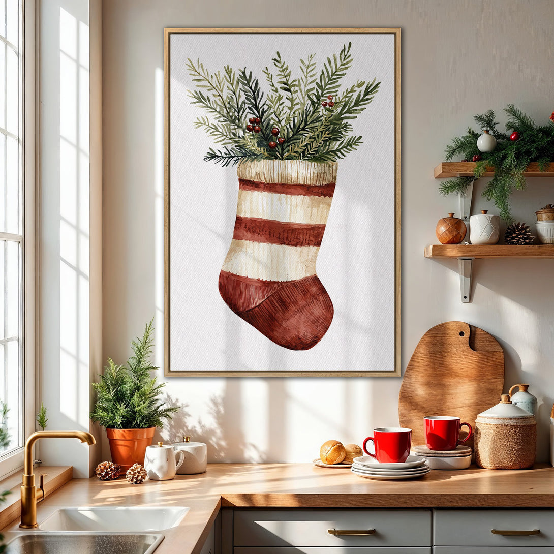 Framed Wall Art: Watercolor Christmas stocking print with greenery. Rustic style, warm red, green, and cream palette, perfect for holiday decor.