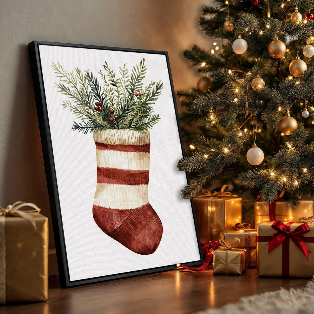 Framed Wall Art: Watercolor Christmas stocking print with greenery & berries, displayed in a festive interior. Warm red, green, and beige palette, perfect holiday decor.