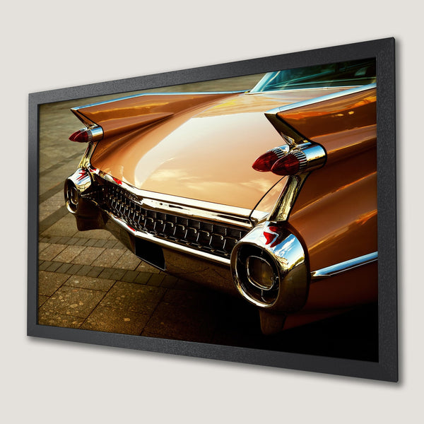 Framed Poster featuring a vintage car's tail in warm tones. Classic style with a bronze, gold, and red color palette. Perfect for car enthusiasts!