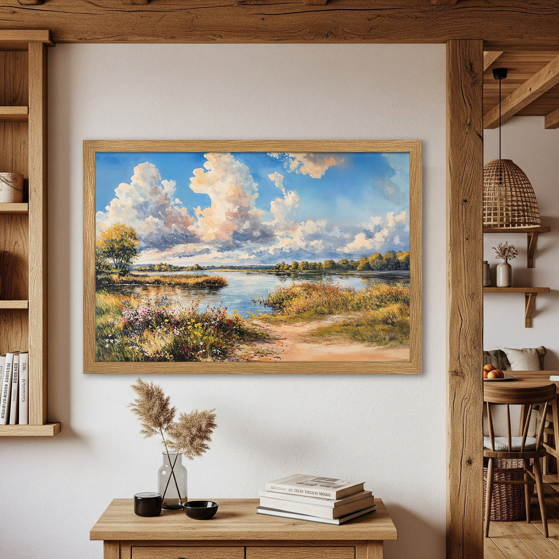 Framed Poster of a serene landscape painting with blue sky, fluffy clouds, and warm earth tones. Perfect wall art!