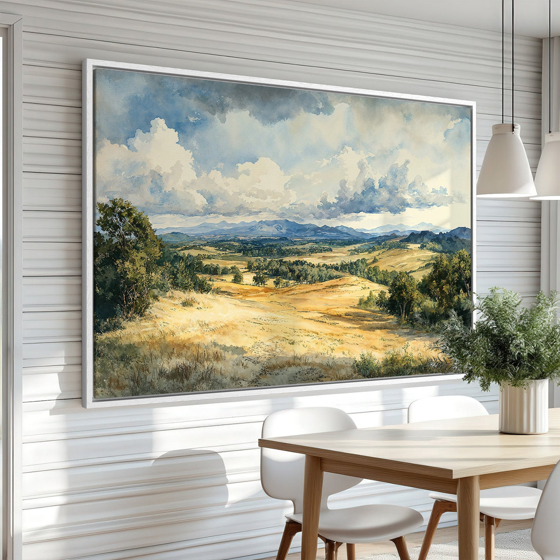Framed Wall Art: Watercolor landscape canvas print in a dining room. Features a serene, natural scene with a warm, earthy color palette.