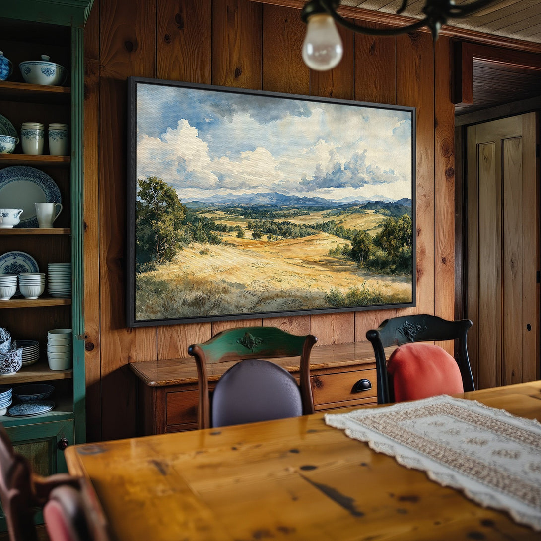 Framed Wall Art: Landscape Canvas Print in a rustic interior. Watercolor style with a warm, earthy color palette of browns, greens, and blues.