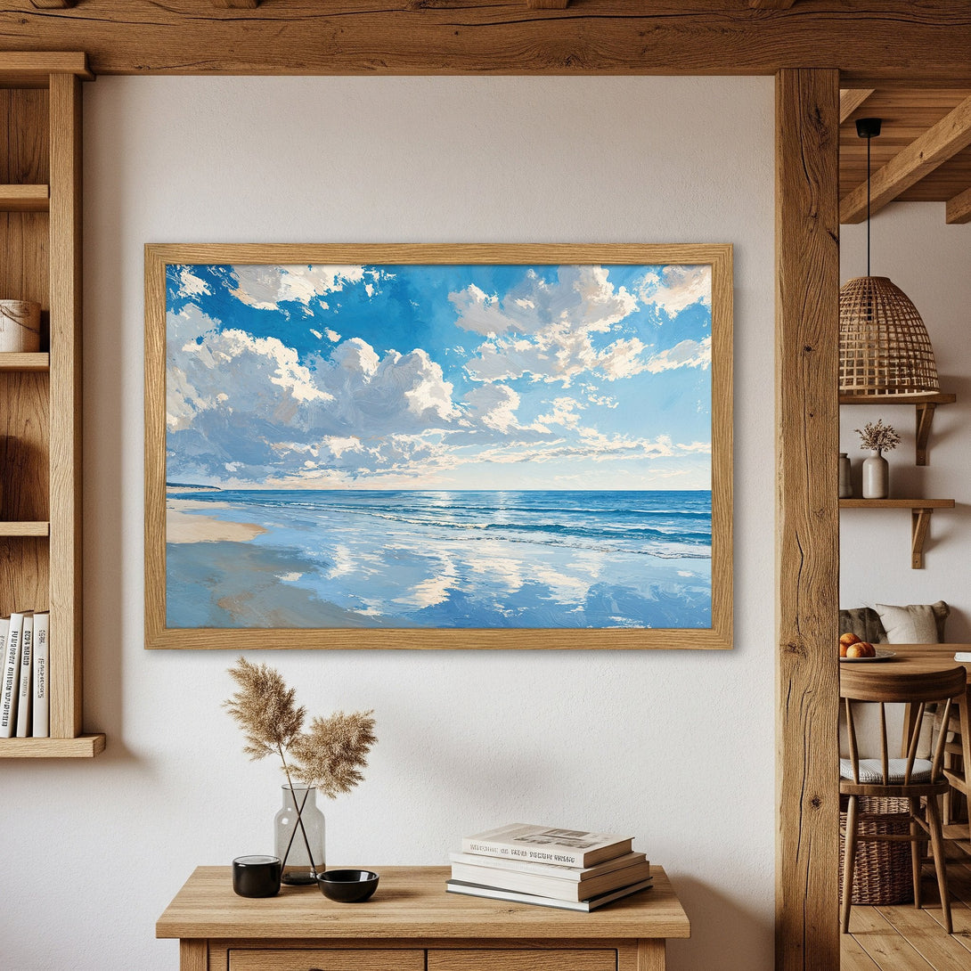 Framed Poster featuring a serene beach scene with blue sky and white clouds. Impressionistic style, cool blue and neutral color palette. Perfect wall art.