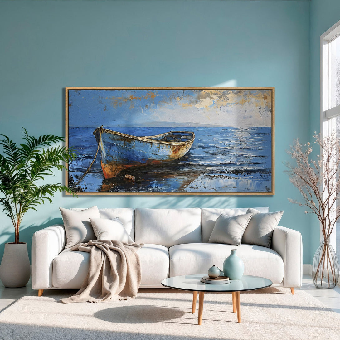 Framed Wall Art: Coastal boat painting in blue and gold tones. Add a touch of serenity to your space with this beautiful canvas print.