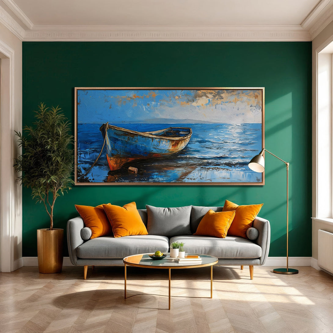Framed Wall Art: Coastal boat scene in blue and orange tones. Modern interior with green wall, grey sofa, and gold accents. Enhance your space!