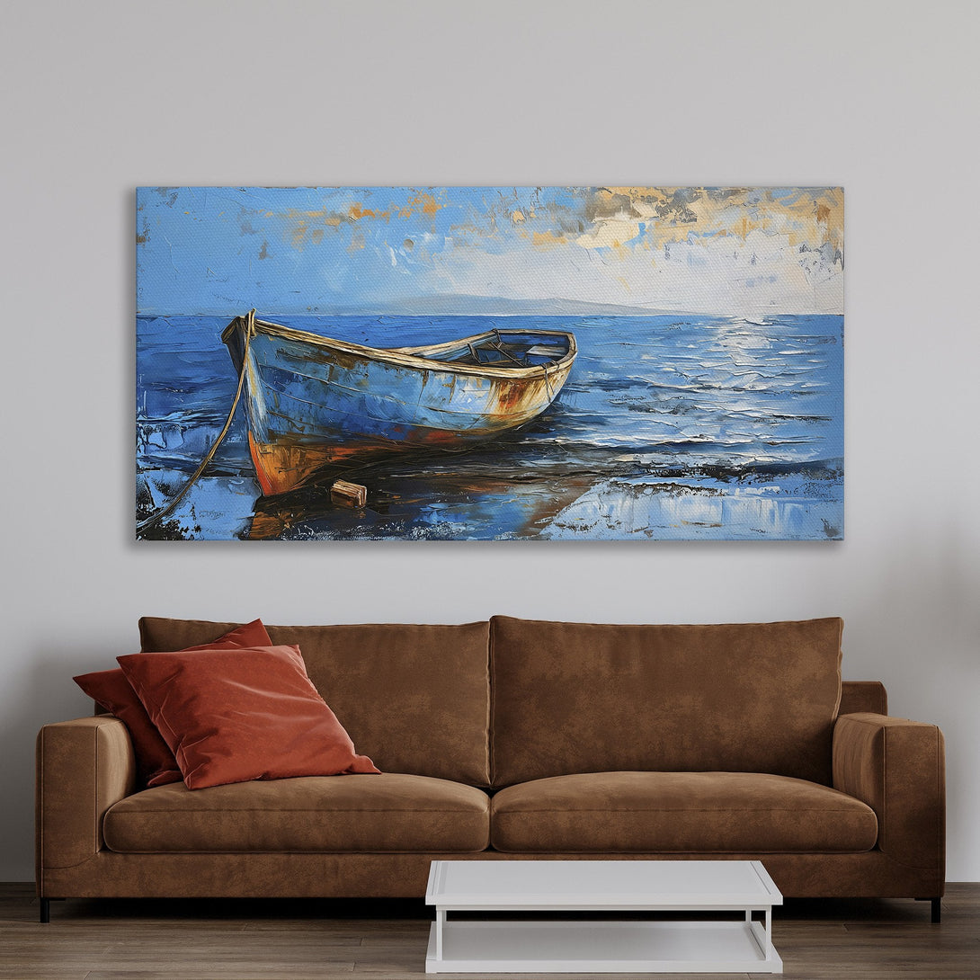 Framed Wall Art: Blue boat painting in a coastal style. Beautiful blue and gold color palette adds a serene touch to any space. Shop now!