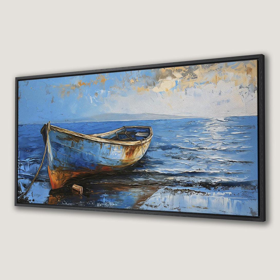 Framed Wall Art: Textured oil painting of a boat on the shore, featuring a blue and orange color palette. Coastal art for a calming space.