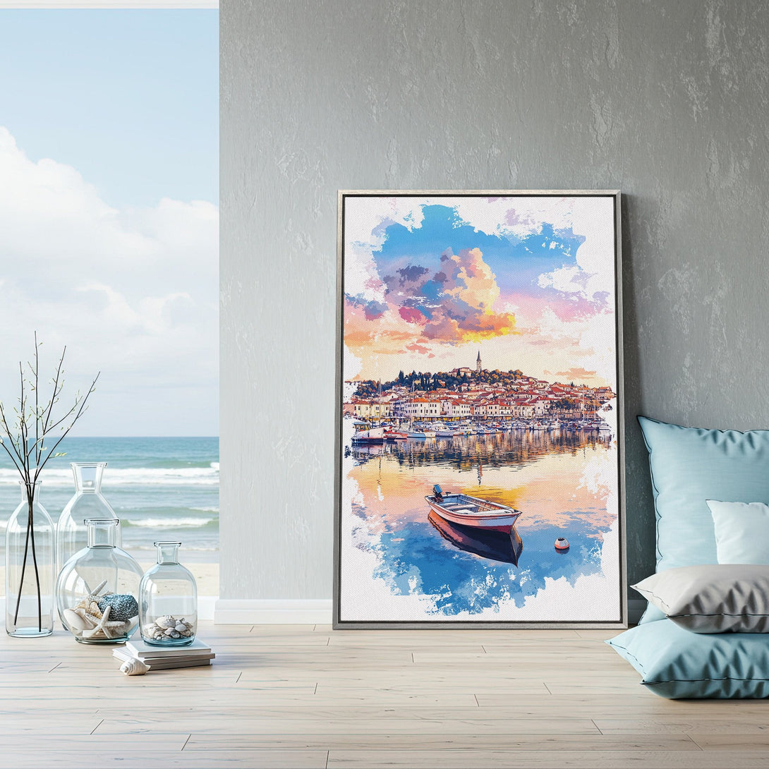 Framed Wall Art featuring a coastal town watercolor painting. Soft blues, pinks, and oranges create a serene and artistic vibe. Perfect for adding a touch of elegance.