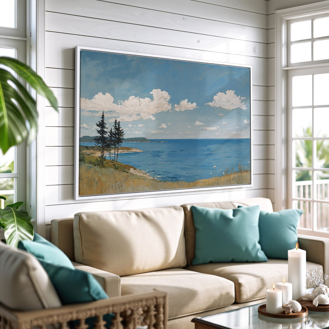 Framed Wall Art of a coastal landscape in blue and neutral tones. Canvas Print adds a serene touch to a living room, perfect for home decor.