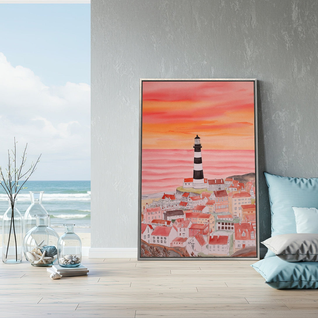 Framed Wall Art: Watercolor lighthouse & coastal town art print with warm sunset colors. Coastal decor for a serene home.