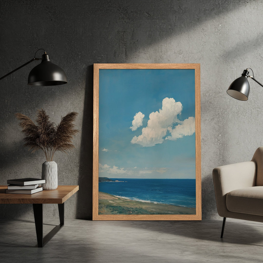 Framed Poster of a serene seascape painting with blue sky, white clouds, and ocean in a neutral color palette.
