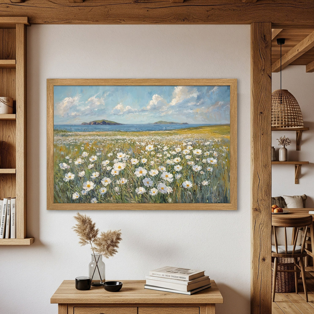 Framed Poster of a field of white flowers with a blue sky and sea. Impressionist style, soft color palette. Perfect wall art.