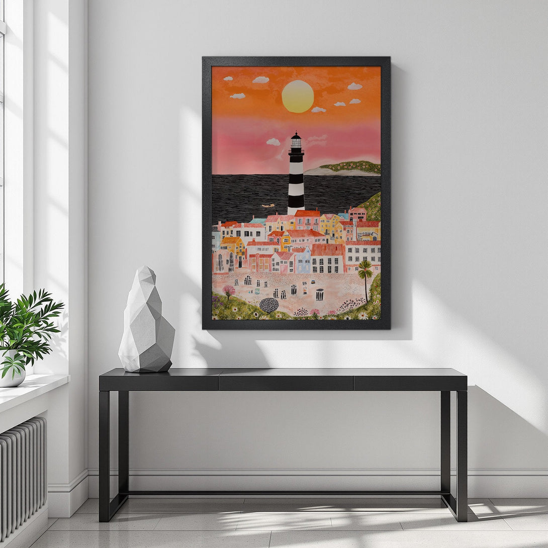 Framed Poster of a coastal town with a lighthouse, vibrant colors, and a sunset. Perfect wall art for your home!