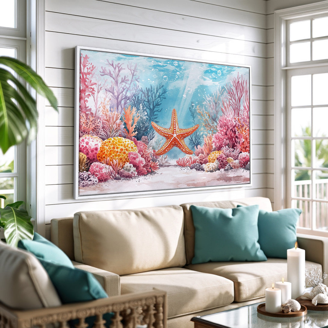 Framed Wall Art: Watercolor starfish and coral reef art. Coastal style canvas print with a vibrant, warm color palette of blues, corals, and oranges.