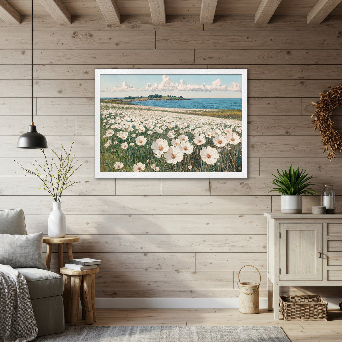 Framed Poster of white flowers by the sea. Coastal art print in a calming blue, green, and white color palette. Perfect for a serene home decor update.