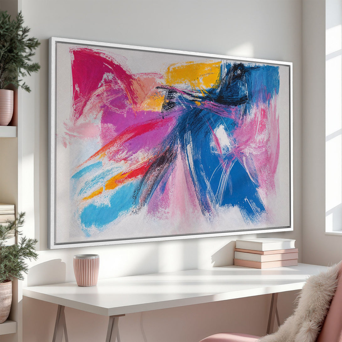 Abstract Canvas Print art in a modern interior. Featuring vibrant brushstrokes in blue, pink, yellow, and white. Perfect for adding a pop of color.