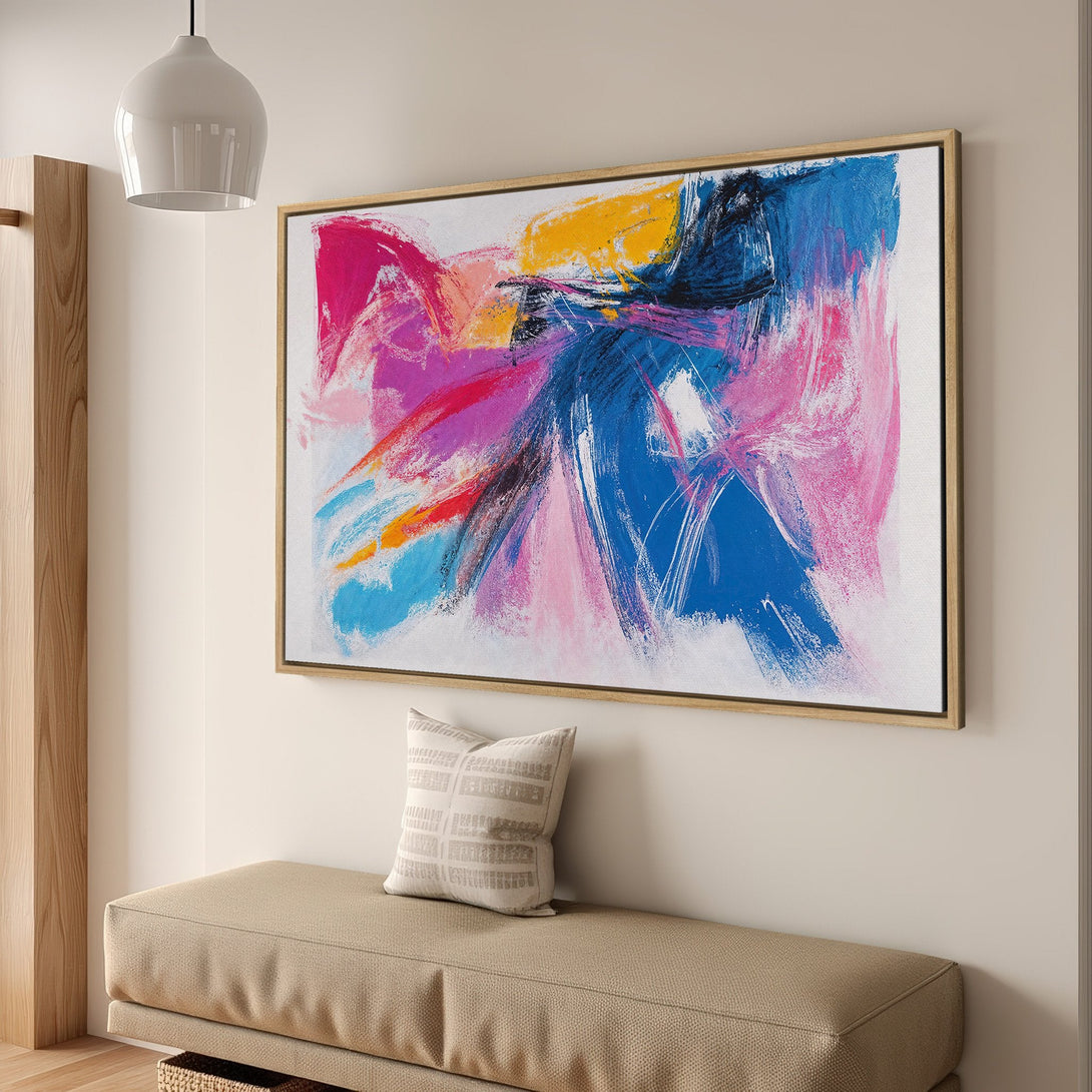 Framed Wall Art: Abstract expressionist canvas print in vibrant pink, blue, and yellow hues. Modern art for living room decor.