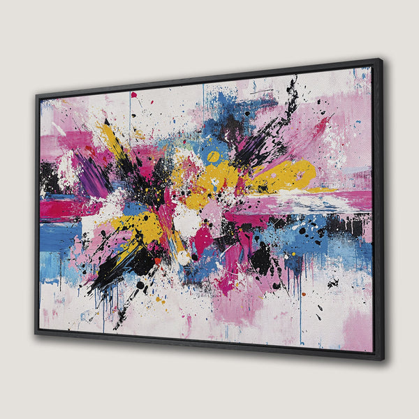Framed Wall Art: Abstract expressionist canvas print with vibrant pink, yellow, blue, and black paint splatter. Modern art to elevate your home decor.
