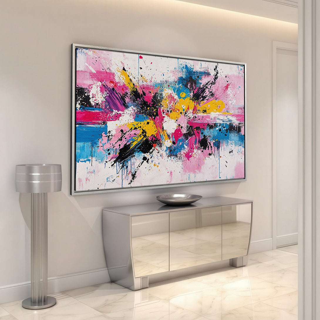 Framed Wall Art: Abstract expressionist canvas print with vibrant pink, blue, and yellow brushstrokes. Modern art for a stylish home.