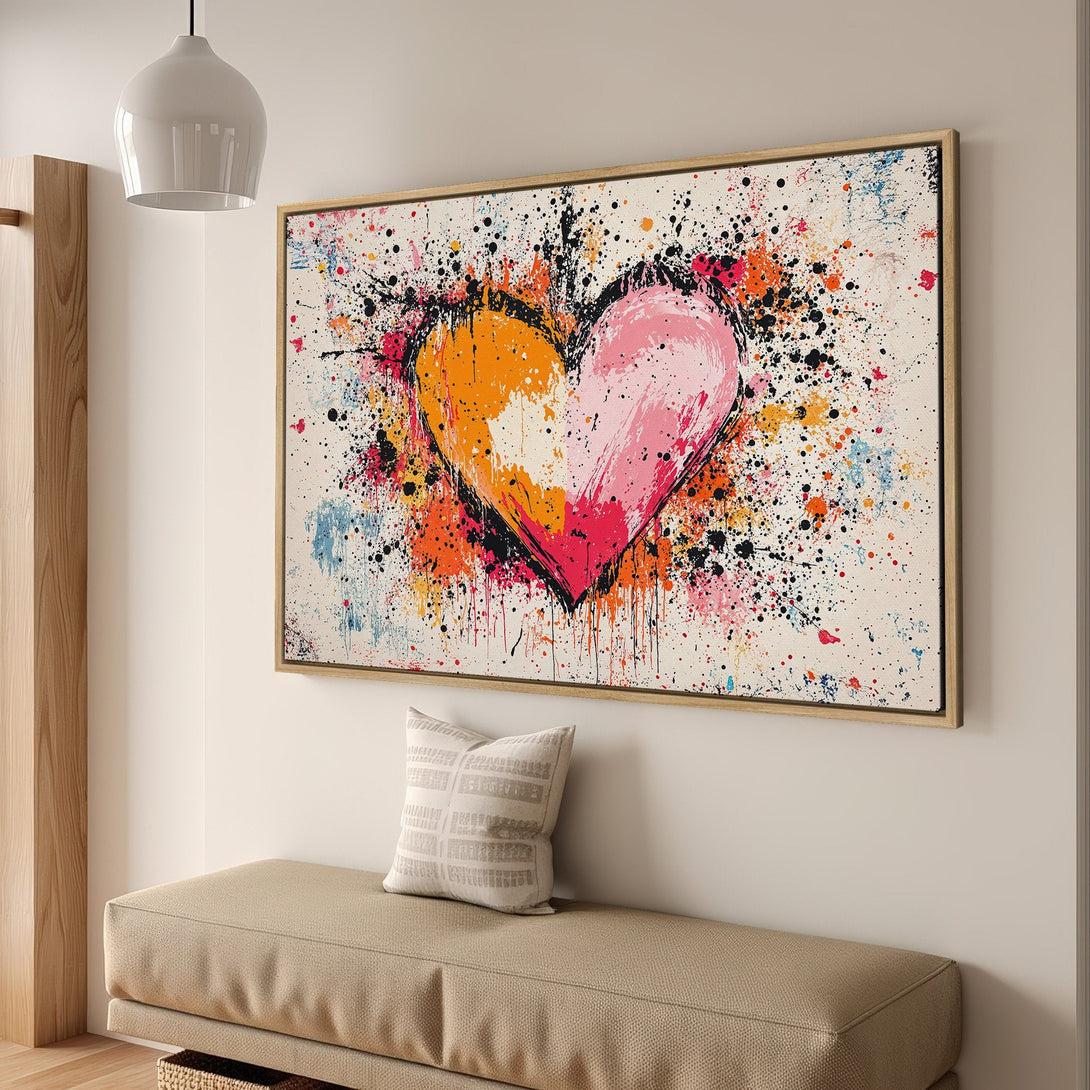 Framed Wall Art: Abstract heart canvas print in vibrant orange, pink, and black splatter art style. Perfect for modern home decor.