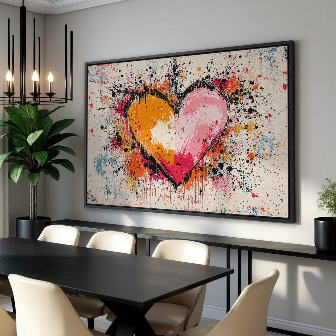 Framed Wall Art: Abstract heart canvas print with vibrant splashes of orange, pink, and red. Modern art for any room.