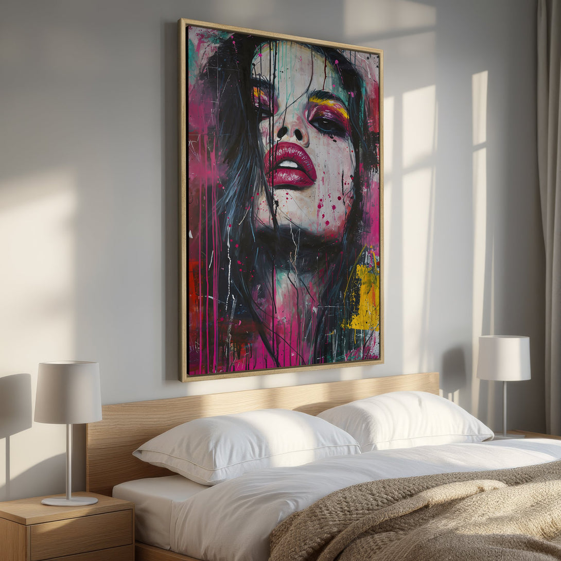 Framed Wall Art: Bold pop art portrait in pink, red, and yellow hues. Modern canvas print adds a vibrant touch to any bedroom decor.