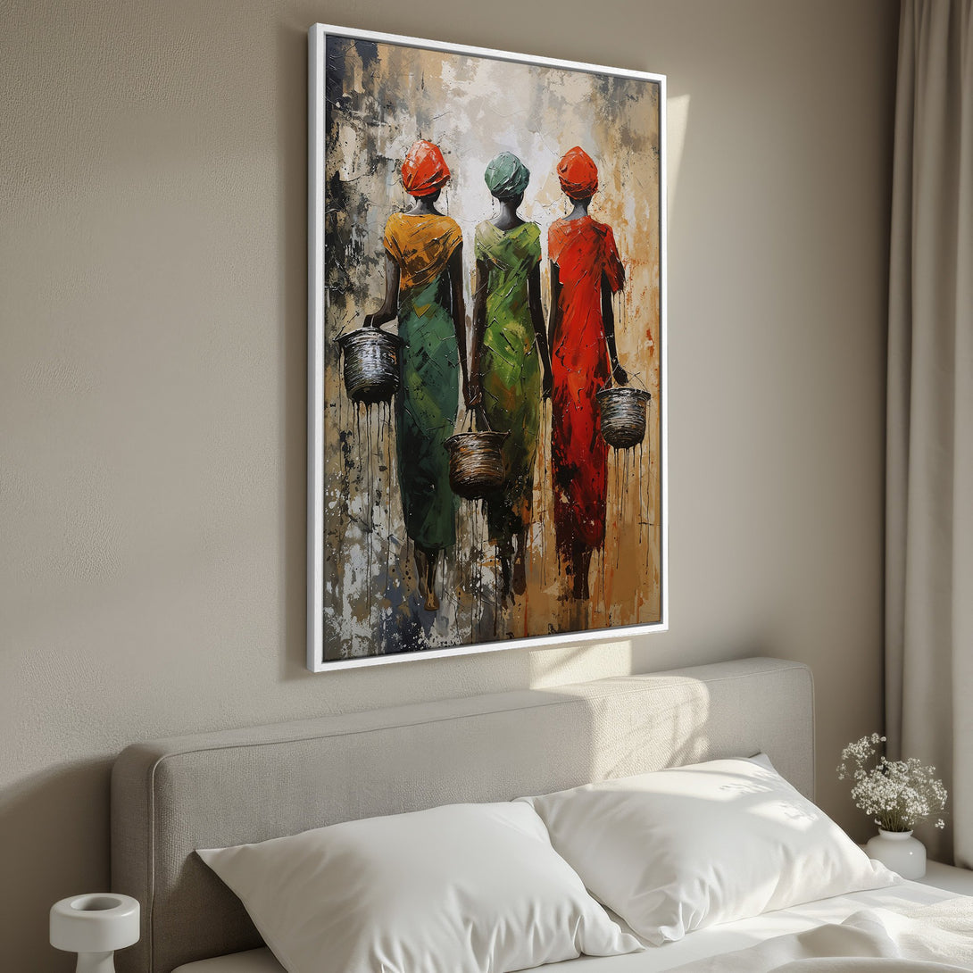 Framed Wall Art featuring three women in colorful dresses. Abstract style with warm, earthy tones. Perfect bedroom decor.