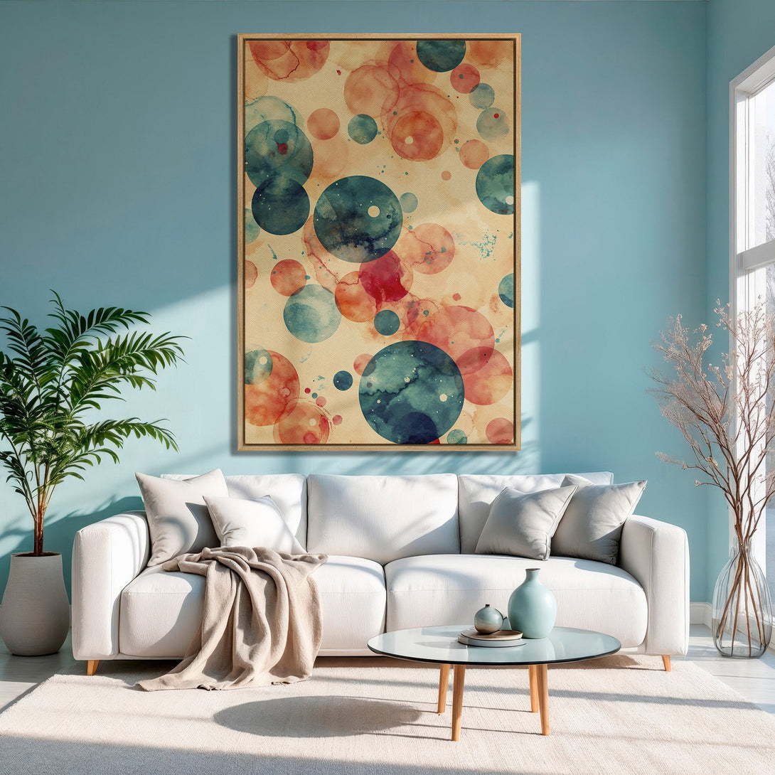Framed Wall Art: Abstract watercolor circles in teal, coral, and beige. Modern Canvas Print adds a pop of color to a stylish living room.