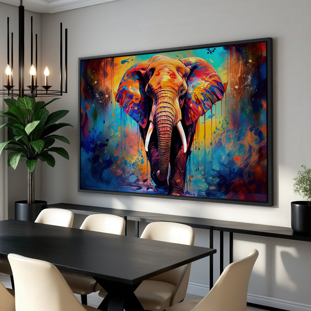 Framed Wall Art: Vibrant elephant canvas print in a modern, colorful style. Bold blues, oranges, and yellows create a stunning focal point for any room.