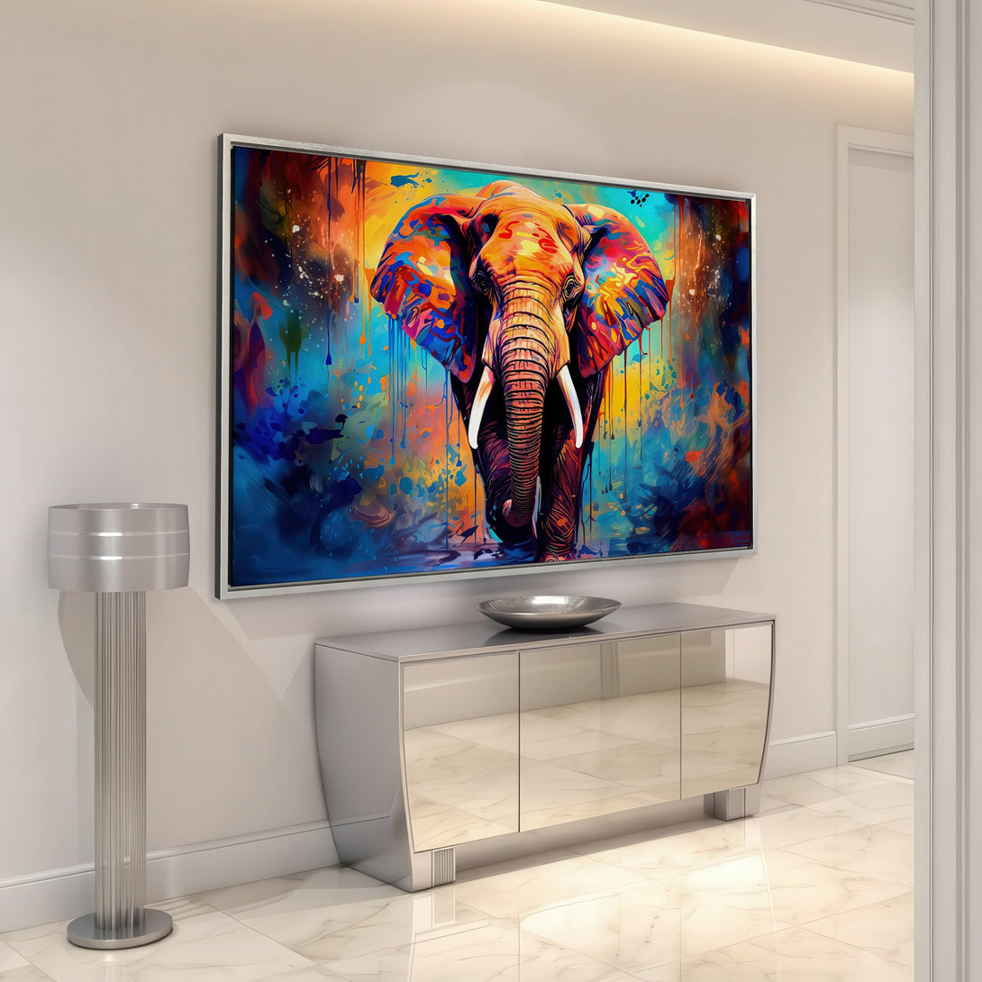 Framed Wall Art: Colorful elephant canvas print in abstract style. Vibrant blues, oranges, and reds create a stunning focal point for any space. Shop now!