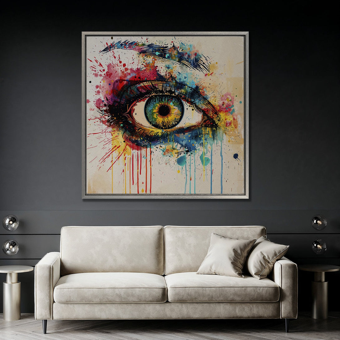 Framed Wall Art: Abstract eye with colorful watercolor paint splatters. Modern art canvas print with vibrant blues, yellows, and reds. Perfect home decor.