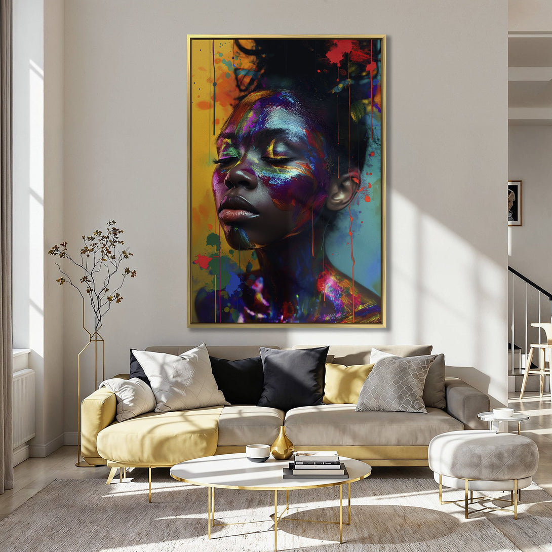 Canvas Print of a Black woman's face with colorful paint splatters. Vibrant, abstract art in a modern interior.