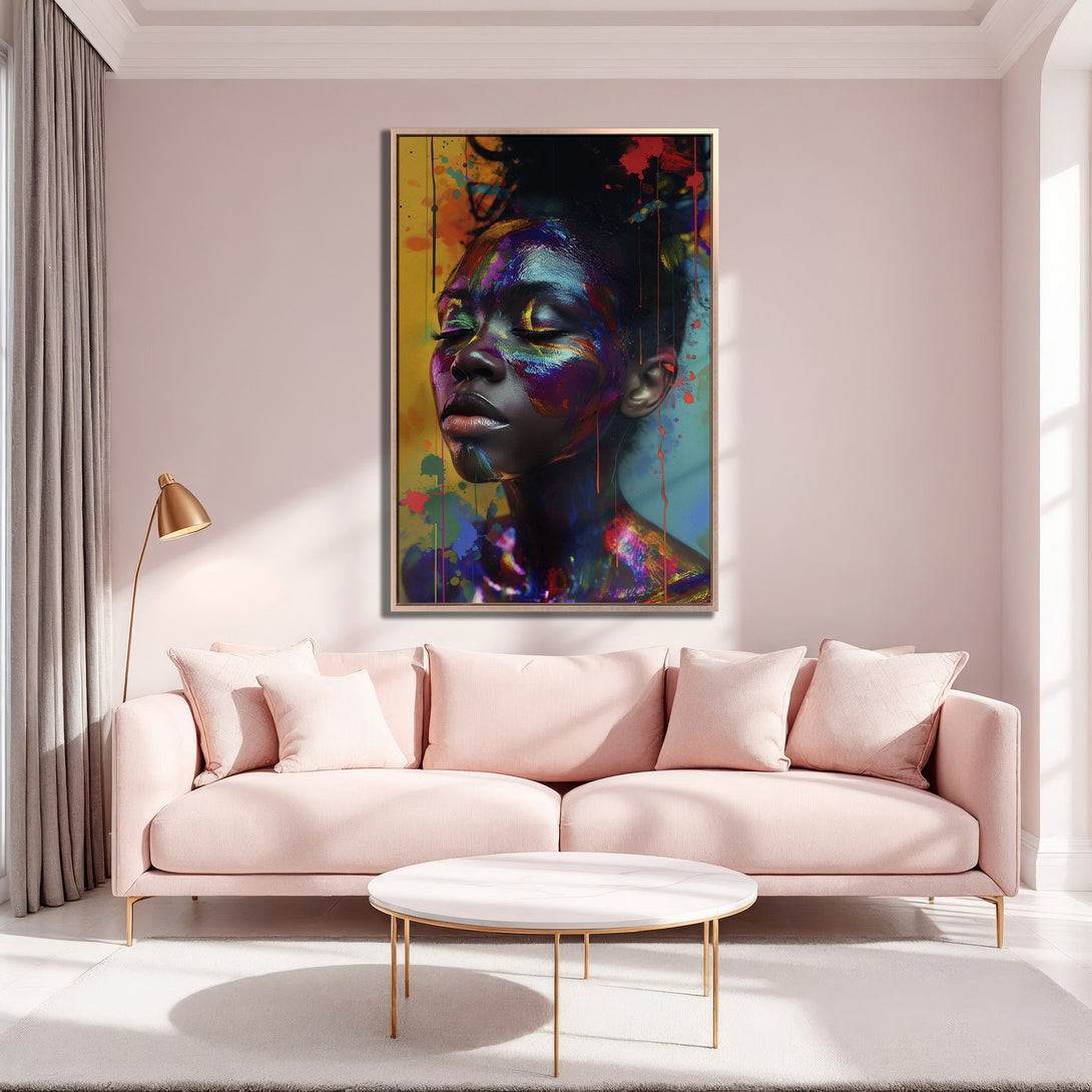 Framed Wall Art featuring a woman with colorful paint, modern art style, vibrant colors on a pink background.