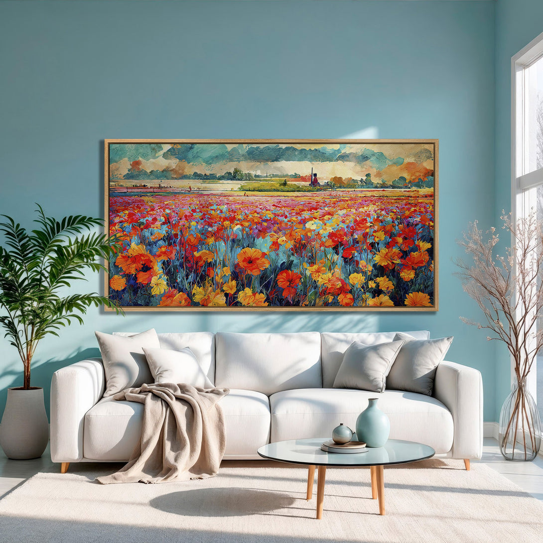 Framed Wall Art: Vibrant floral field canvas print in a modern living room. Features a colorful palette of red, orange, and yellow against a blue background.