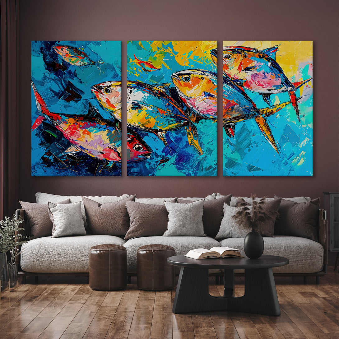 Vibrant Canvas Print of colorful fish in an abstract style, displayed in a modern interior. Features a blue, yellow, and red color palette.