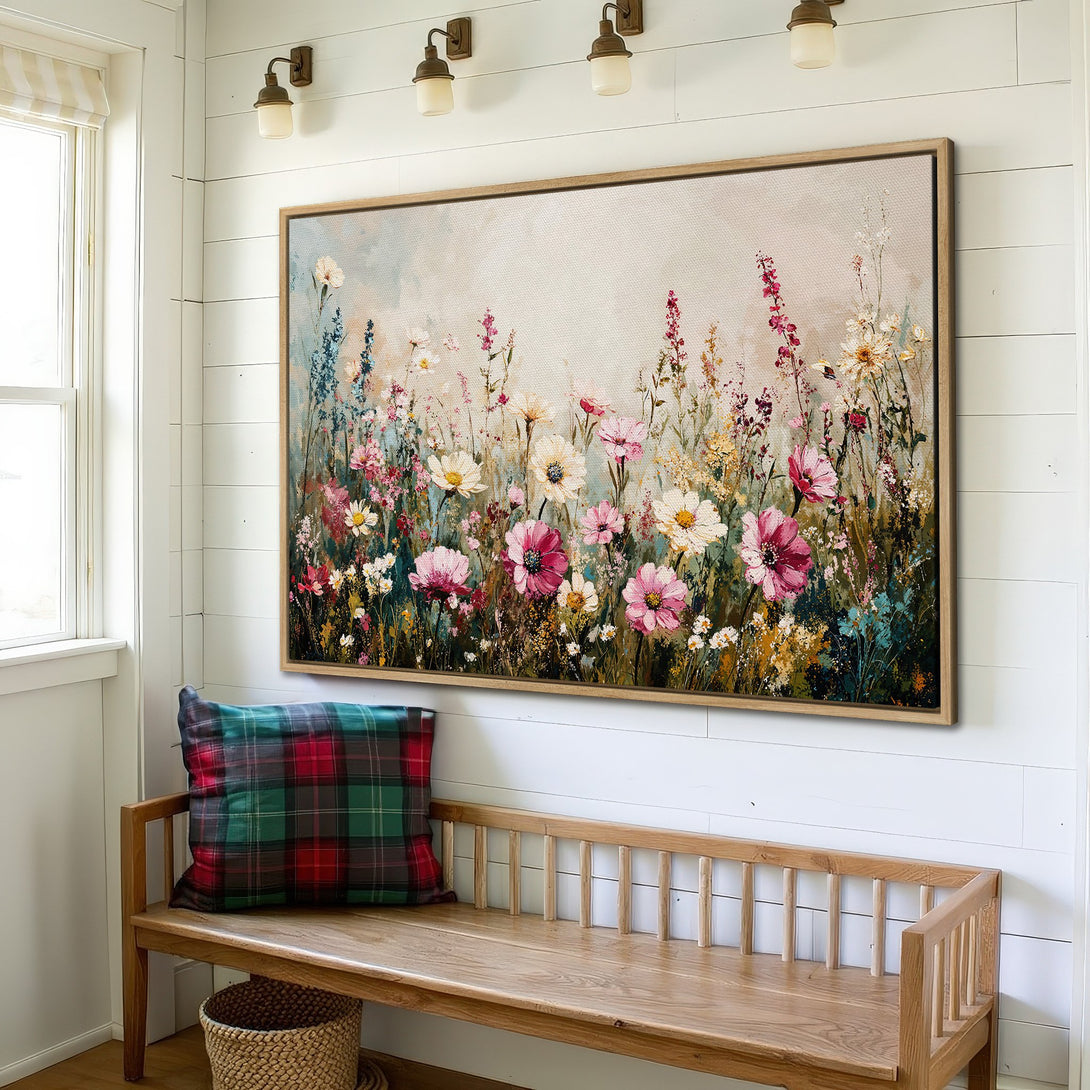 Framed Wall Art of a vibrant floral meadow in a farmhouse interior. Soft pastel color palette with pink, white, and blue flowers. Perfect for adding a touch of nature.