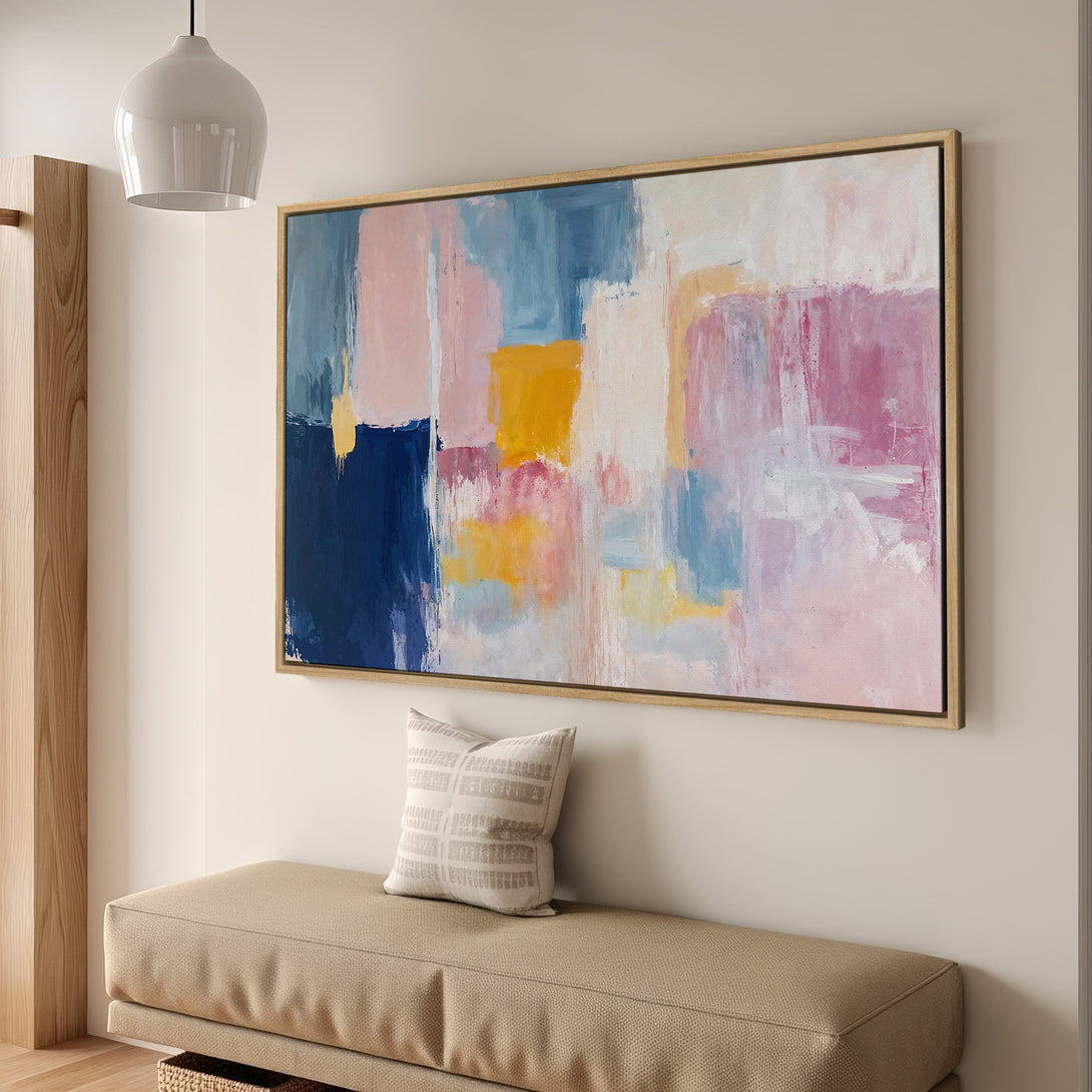 Framed Wall Art: Abstract canvas print with a colorful palette of blues, pinks, and yellows. Modern art for your home decor.