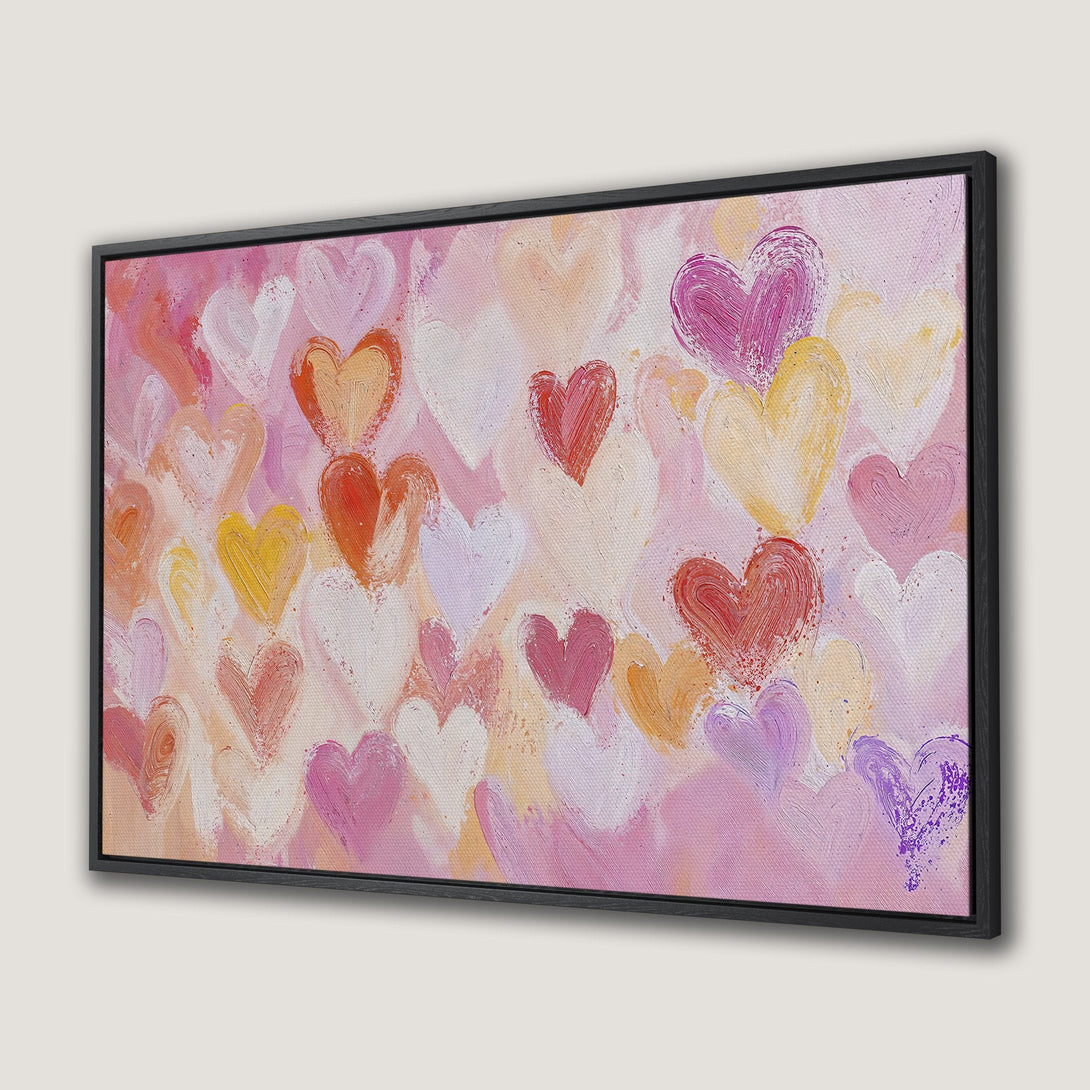 Framed Wall Art featuring a romantic heart painting in a warm, pink, and orange color palette. Perfect for adding love and joy to your space!