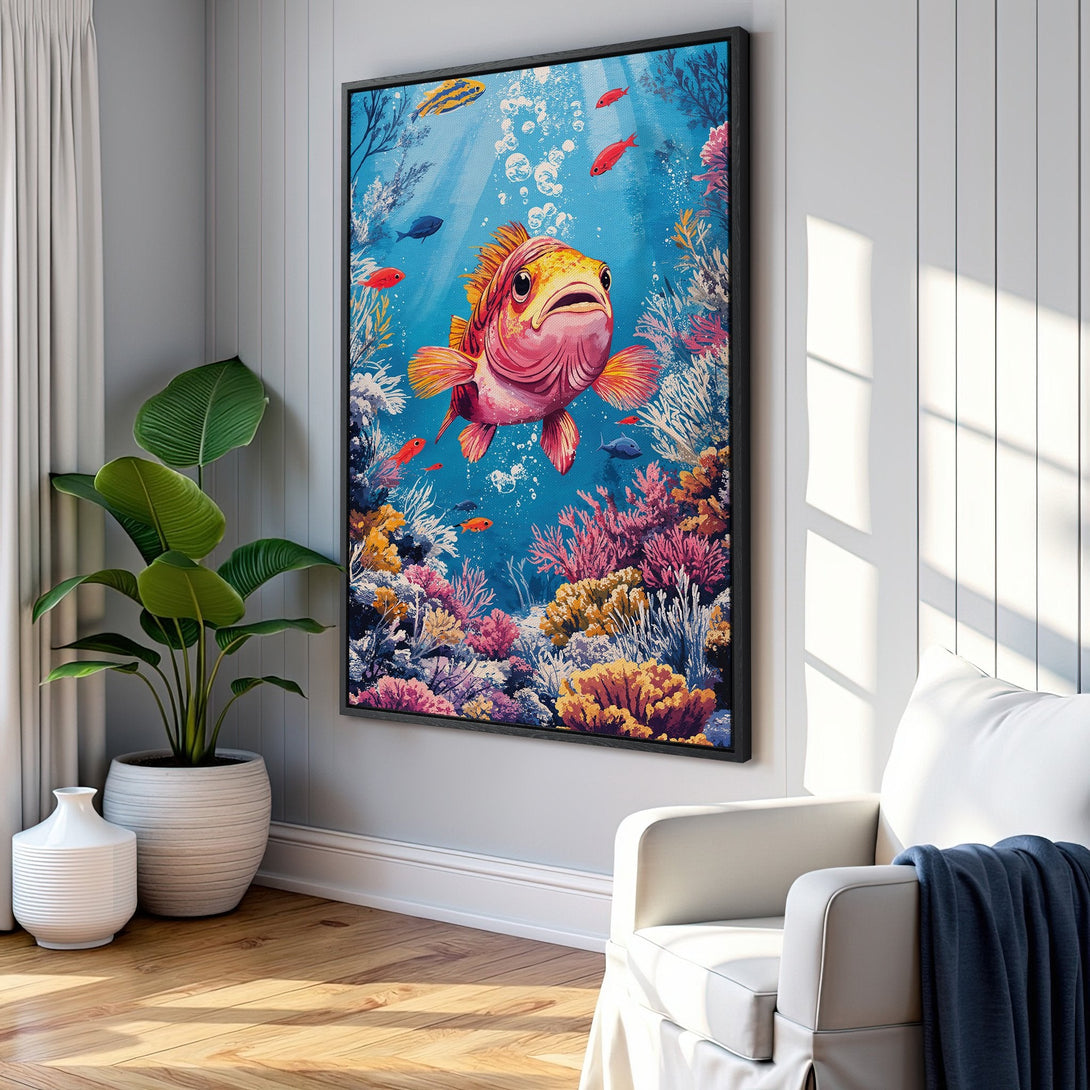 Framed Wall Art: Whimsical underwater scene Canvas Print featuring a colorful pink fish, coral reef, and blue water. Perfect for coastal decor.