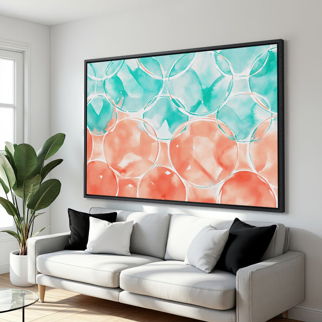 Framed Wall Art featuring abstract watercolor bubbles in teal and coral. Modern art canvas print adds a pop of color to any living room.