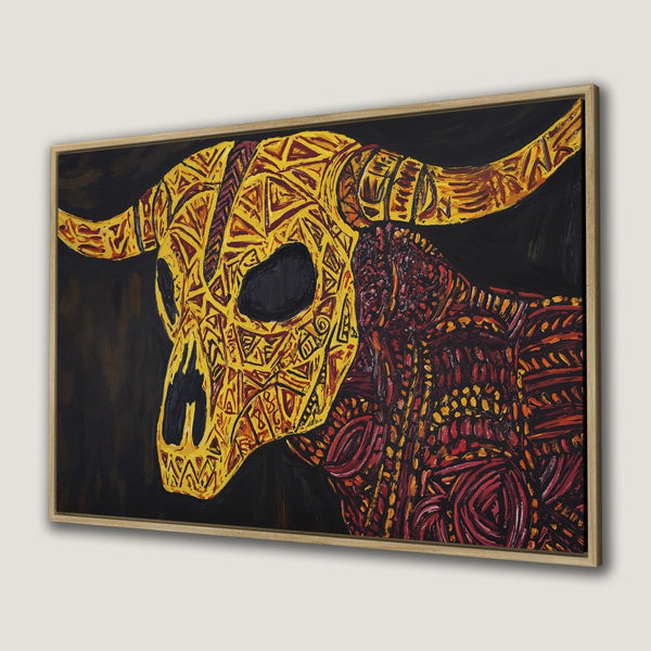Framed Wall Art: Bold bull skull canvas print in yellow, red, and black. Tribal art style for modern home decor.